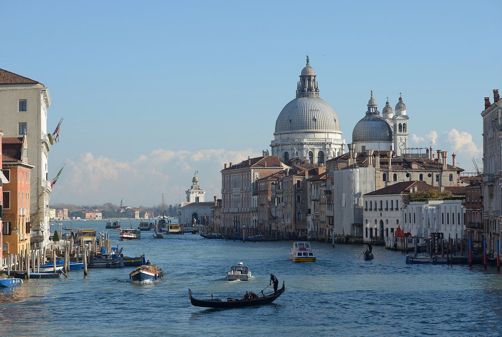 The Grand Canal from the Accademia Bridge, with the domes of Santa Maria della Salute ahead and a gondola crossing in the foreground